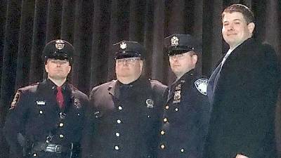 From left: Patrolman Harter is congratulated by his father, retired New York State Trooper and Village of Florida police officer Daniel Harter Sr.; brothers, Port Authority of New York and New Jersey police officer Jonathan Harter; and Daniel Harter Jr., mayor of the Village of Florida