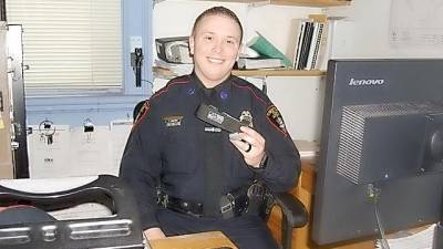 Patrolman Robert Kozlowski with the Village of Goshen Police Department holding the CAT Application Tourniquet that aided in saving the life of a Goshen woman. Officer Kozlowski calls it an invaluable tool in halting uncontrollable bleeding and saving lives.