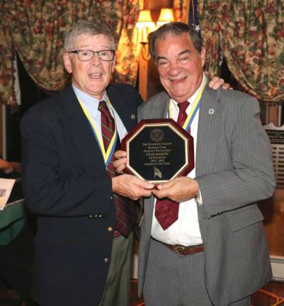 Photos by Roger Gavan Warwick Valley Rotary President Dave Eaton (left) presents the Citizen of the Year Award to Stan Martin.