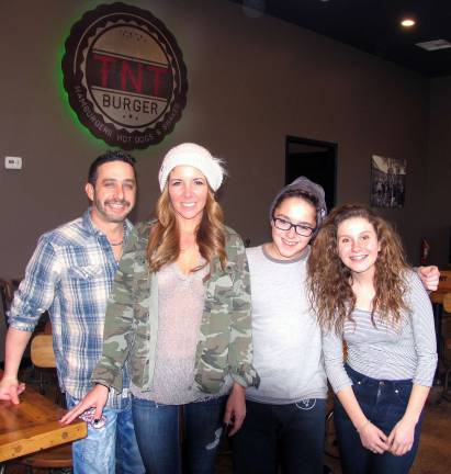 Photo by Roger Gavan On Saturday, Jan. 16, TNT Burger restaurant at 62 Galloway Road opened its doors. From left, owners Todd and Kristy Rosen with their son Aiden and niece Lauren Scott.