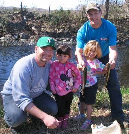 Dads and daughters who caught two trout, a Rainbow and a Brown: From left, Adam Becz and his daughter Emma, 3, with Larry Cuccio Jr. and his daughter, Makuyla, 6.