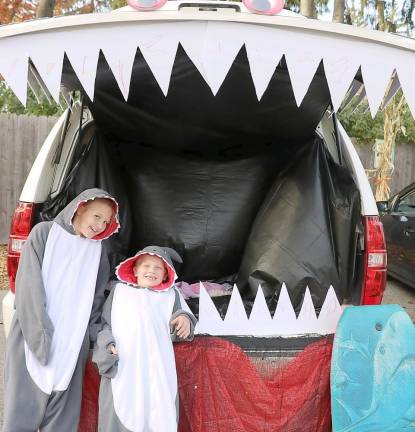 Sarah Robeson, 10, and her brother Aiden, 7, don't appear to be worried that Jaws is just behind them.