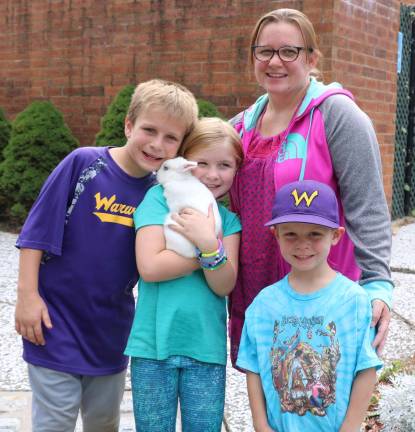 Kerry Baird and her children Robert, 11, Kathleen, 9, and Sean, 6, brought their pet rabbit &quot;Freckle.&quot;