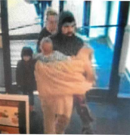 Photo provided Surveillance footage released by police shows the alleged shooter, Michael Perez-Rodriguez, along with his wife and two children, at the mall on Sunday.