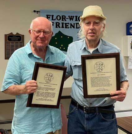Dr. Richard Hull (left) presenting plaques of appreciation to Gary Randall for the years of service that he and his wife, Kathy, have given to the society and the Village of Florida.