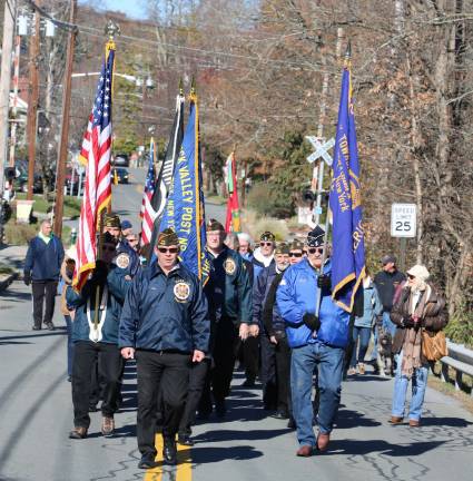 Photos by Roger Gavan VFW Post 4662 Commander Dan Burger led the parade down Forester Avenue.