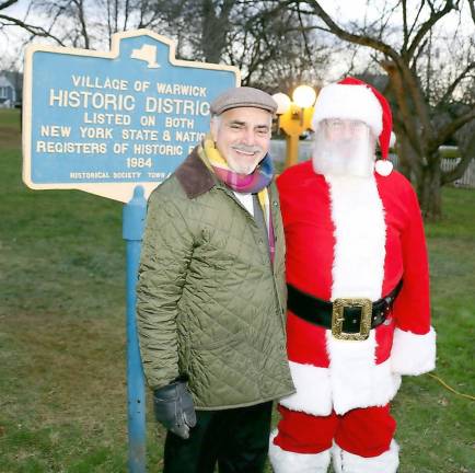 Moshe A-Schwartzberg welcomed another surprise visit by Santa wearing a clear mask.