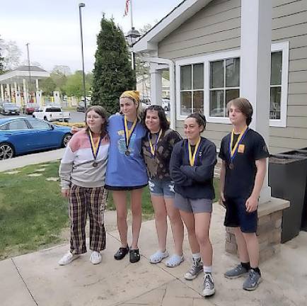 Freshman girls with their Bronze medals: (left to right) Holly Frischknecht, Violet Ross, Madeline Breen, Nadia Ali, Milo Shaw-Smith Gendelman (cox)