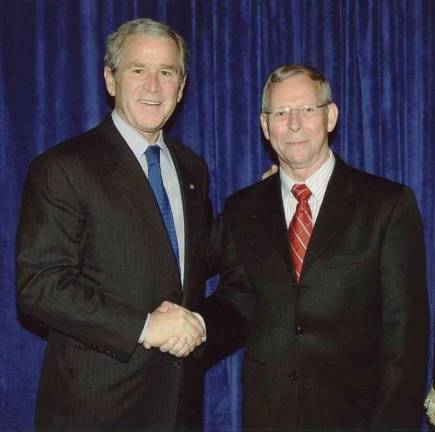 Provided photo Professor Douglas Lovelace Jr. in an official White House photo with then-President George W. Bush.
