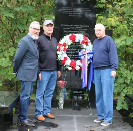 Mayor Michael Newhard retold the history of the monument, inscribed with the names of Warwick residents who perished in the attack, and how a group of concerned citizens raised the funds and saw the project to its completion 15 years ago. From left,the mayor, Monument Committee Board member Jonah Mandelbaum, who was the first to donate to the project, and Committee Chair George Arnott.