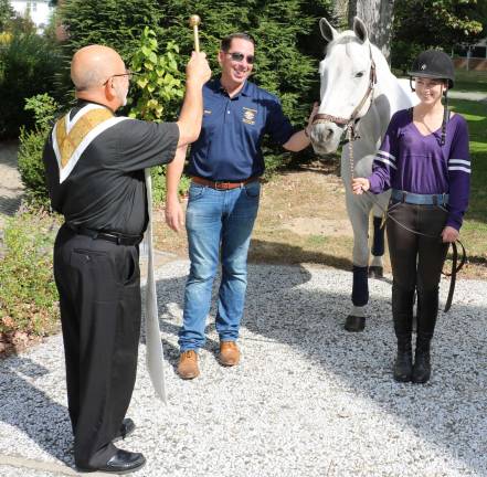 This year Pete Morris and his daughte,r Jordan, 16, brought their Warmblood horse, Sir Charleston, to be blessed.