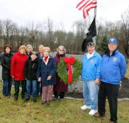 Photo by Roger Gavan On Saturday afternoon, Dec. 15, American Legion Post 214 2nd. Vice Commander Stan Martin (second from right) and 3rd Vice Commander Tom Brennan, along with a group of representatives from the Warwick Valley Gardeners, assembled at Warwick's Veterans Memorial Park to lay a wreath at the Veterans Monument.