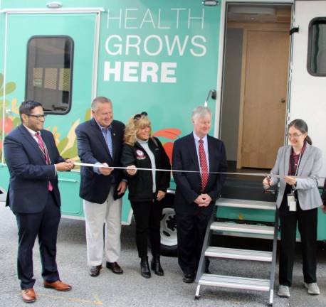 Pictured from left to right are Orange County Deputy Health Commissioner Steve Velez, Legislators Pete Tuohy and Janet Sutherland, Deputy County Executive Harry Porr and Health Commissioner Dr. Alicia Pointer at the ribbon-cutting on Monday for the new Mobile Health Unit. Photo provided by Orange County.