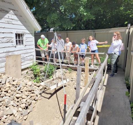 Fourth graders at Park Ave. Elementary view the site of an archaeological dig during their field trip of the Warwick Historical Society’s buildings and properties.