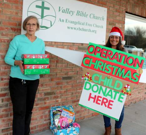 Photo by Roger Gavan Valley Bible Church Trustee Sharon Houston (left) and Dawn Salzillo, head of hospitality, urge everyone to contribute gift items for Operation Christmas Child and to help pack the shoeboxes at a &quot;packing party&quot; next Friday, Nov. 10, at 7 p.m.