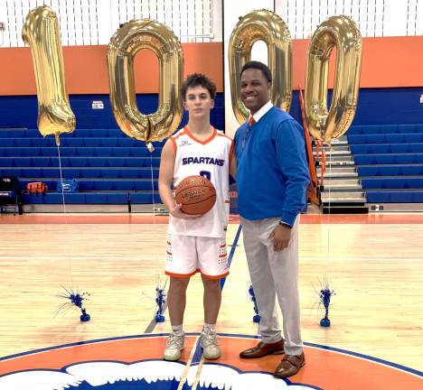 Seward sophomore Grey Whitmore and Coach Michael Washington.