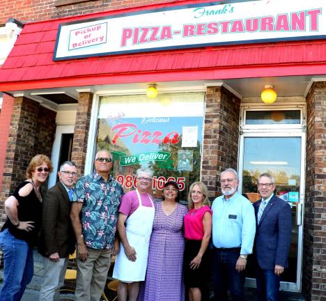 Photo by Roger Gavan On Thursday, Aug. 23, Town of Warwick Supervisor Michael Sweeton (second from left) and members of the Warwick Valley Chamber of Commerce along with business neighbors joined owners Frank and Matt Rinaldi and his wife, Kara, (center) to celebrate the 42 years of the family pizzeria.