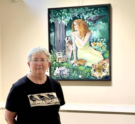 Shelly Meisler poses in front of one of her works.