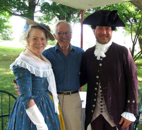 Photos by Roger Gavan Michael Bertolini (center), president of the Town of Warwick Historical Society, poses with Niel DeMarino of PBS&#xed; American Experience, accompanied by Susan Braisted, who served as representatives of the Colonial period of our history.