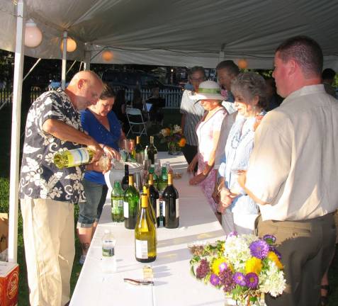 Guests had a choice of outdoor seating as well as gathering under the huge tent. And while enjoying the music of the Warwick Valley High School Chamber Strings, the comfortable temperatures and clear blue skies, they sampled good food, wines and other refreshments donated by local businesses and restaurants.