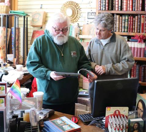 Photo By Roger Gavan Renowned New Yorker cartoonist and author Bob Eckstein (right) visits with Tom Roberts, owner of Ye Olde Warwick Book Shoppe.