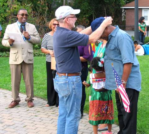 During the program, Warwick Supervisor Michael Sweeton, pictured here, and Mayor Newhard presented gold medals of honor to Imelda Portugal, Beatriz Fernandez, Mariana Castillo, Elodia Figueroo, Berta Torres and Avcadio Cruz.