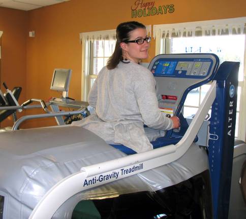 Photo by Roger Gavan Physical Therapist Assistant Michaela Hess, who demonstrated the Alter G Anti-Gravity Treadmill, added that it's easy and fun to use.