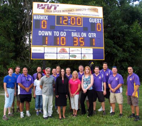 Thanks to a contribution by Warwick Valley Telephone, the league&#xed;s annual season kick-off event was also an opportunity to unveil a brand new scoreboard. To thank WVT for the purchase, league officials held a formal ribbon cutting ceremony at the scoreboard with WVT executives. From left, Mary and Jim Leshinski, Percy Caraballo, Kristine Widulski, Todd Orlando, Mayor Michael Newhard, Frank Giordano, Lisa Decker, WVT President Virginia Quackenbush, Scott Hansen, WVT Marketing Director Jean Beattie, WVYFC Board President Brian Perez, WVT Directory Manager Kathy Neu, Scott Walter, Domenico Berlingieri, Paul LeDuc and Bill Garcia.