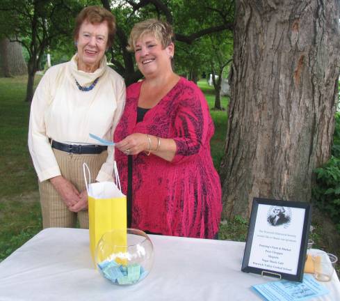 During the event, Village Historian Jean May (left) and the SocietyþÄôs Executive Director Sharon Knol conducted a drawing for the prize winners of those who took a local history quiz and submitted their names and answers after a recent walking tour conducted by the Historical Society. The first place $250 prizewinner was Sarah Beyrich.