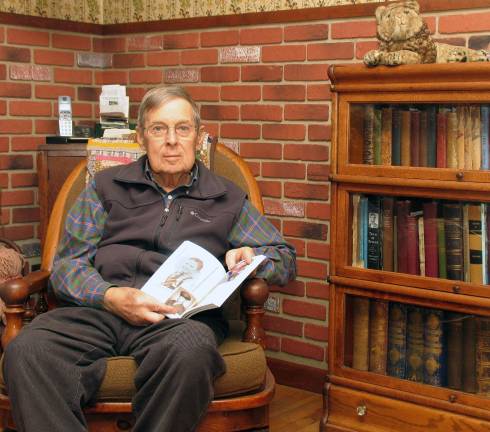 Photo by Roger Gavan Author John J. Kimiecik relaxes alongside his local history collection with his new book, "Touching all the Bases, Places and Faces in Early Florida, New York." The Florida Historical Society will hold a book signing for him from 1 to 4 p.m. on Saturday, April 11, at the S.S. Seward Institute.