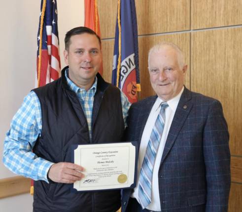 County Steve Neuhaus gives Tom Mulcahy Citizen of the Month Award.