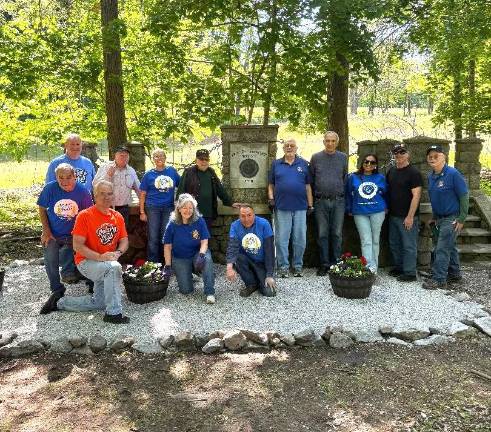 Rotary volunteers who helped clean up Warwick Cemetery included, left to right, front row, Stan Martin, Leo R. Kaytes, Tina Buck and John McGloin; back row, Bob Carl, Ed Wiley, Maria Codd-Perez, Tony Cosimano, Mike Eckert, Al Hauser, Melissa Colon, Neil Sinclair and Doug Stage.