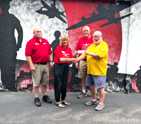 Pictured from left to right are Vinnie Hallinan, Post 1443 Commander, Marianne Schmidt, Board Member and Safety Coordinator, Mike Schmidt, Flight Team Member and Past Guardian, and Jim Clifford, Greenwood Lake Lions Club.
