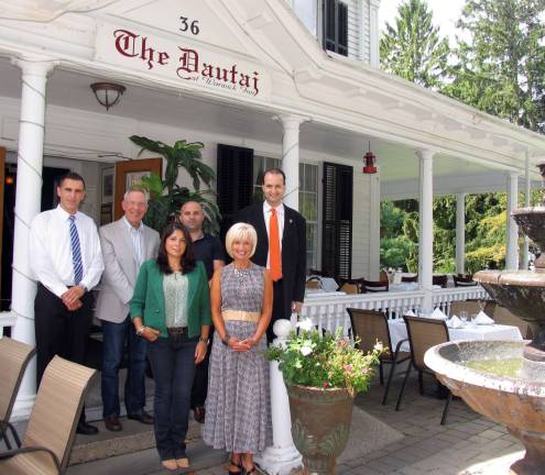 Photo by Roger Gavan Event co-chairs Julia Lawrence and Janine Dethmers (both dressed in apparel from the new 2013 designer clothing collection by CAbi) finalize plans for the Warwick Valley Chamber of Commerce Sept. 24 &quot;Style for Fall&quot; fashion show and business mixer at The Dautaj Restaurant. From left, Dautaj Manager Val Berisha, Warwick Valley Chamber of Commerce Executive Director Michael Johndrow, Dautaj co-owner Jimmy Jashanica, and Chamber President Paul Rafanello.