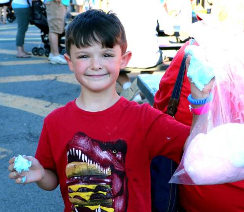 Photos by Roger Gavan Matthew Peine, 5, enjoys cotton candy.