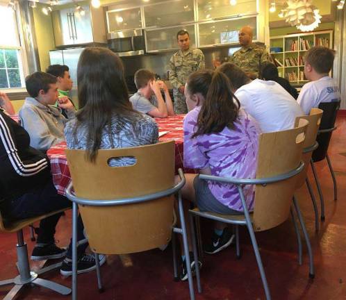 Photo provided by Annie Colonna Warwick Valley Community Center&#x2019;s Youth Advisory Board members met recently with the National Guard Counterdrug Task Force to design stickers for an upcoming &#x201c;sticker shock&#x201d; campaign to alert people to the consequences of drug use.