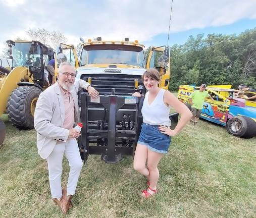 Village of Warwick Mayor Michael Newhard and Mary Collura, creator of the Warwick Valley SceneZine, check out the Village’s DPW truck.