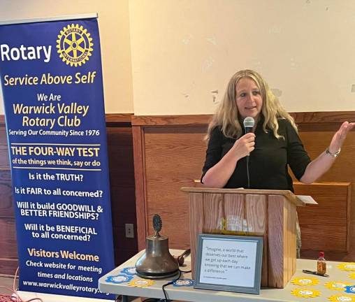Warwick Valley Rotary Club President Laura Barca outlines her goals for the 70-plus member service organization during installation ceremonies, June 29 at Wickham Woodlands Manor House, on the grounds of the former Mid-Orange Correction Facility.