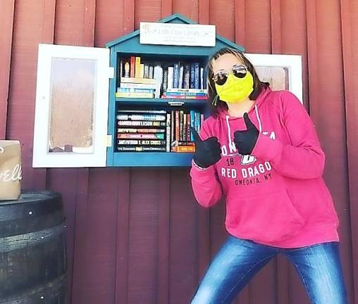Florida Public Library circulation supervisor Ashley Baroch is all geared up to make sure FPL’s Little Free Library on the front porch of Roe Brothers is clean and ready for patrons to select a book. She'll also mak recommendations for you via email and then leave the book here for you.