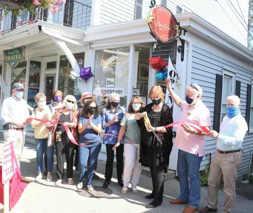 In September, Town of Warwick Supervisor Michael Sweeton (left), Warwick Valley Chamber of Commerce President James Mezzetti (right) and chamber members joined owner Rachel Bertoni (cutting ribbon), local artists, associates and customers to celebrate the 20th anniversary of Bertoni Gallery with a traditional ribbon-cutting.