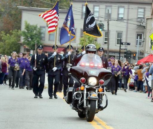 The Homecoming parade, led by the Warwick Police Department Color Guard and the Warwick Valley High School Band, arrives at Main Street. Photos by Roger Gavan.