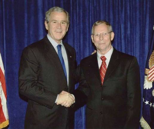 Provided photo An official photo of Prof. Douglas C. Lovelace Jr. taken with former President George W. Bush. This coming Saturday morning, Lovelace, the director of the Strategic Studies Institute, will be interviewed live on Orange County Radio WTBQ (AM 1110/FM 93.5).