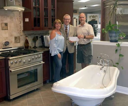 Provided photo The Final Round Game Sponsor for this year's event is Kitchen &amp; Bath Works. From left, Mechelle Casciotta, president of the Warwick Valley Chamber of Commerce, Executive Director Michael Johndrow and Scott Rothamel, co-owner of Kitchen &amp; Bath Works.