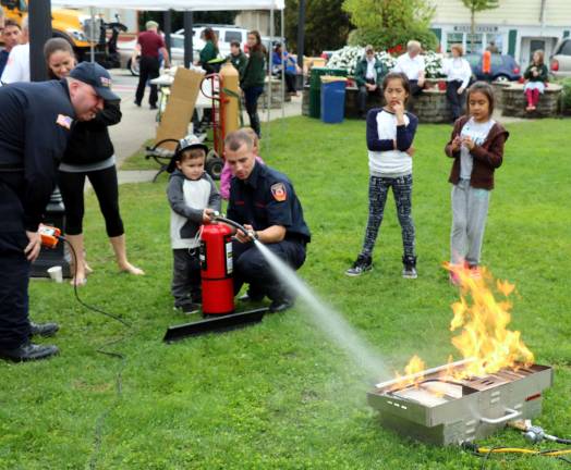 Members of the Warwick Fire Department also invited children to learn how to properly use a fire extinguisher.