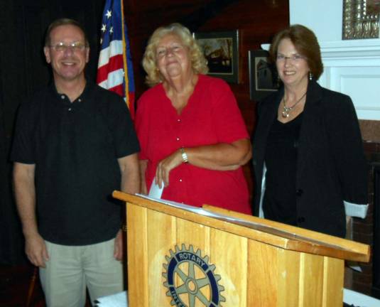 Photo by Stan Martin In this photos, Rotary President Neil Sinclair presents a check to Dottie Ehlers, long-time volunteer for the Florida Food Pantry, and Mary Jean McHugh, vice president of the Greenwood Lake Food Pantry. The women thanked the Rotary members of their contribution, saying food demands are at an all-time high this year.