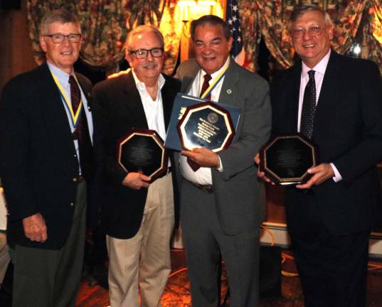 The historic Landmark Inn was filled to capacity on Wednesday evening, Oct. 25, for the annual Warwick Valley Rotary Club presentation of the Citizen of the Year and Outstanding Community Service awards celebration. From left, Warwick Rotary President Dave Eaton, Outstanding Community Service Award winner Paul Orthmann, Citizen of the Year Stan Martin and Outstanding Community Service Award winnerTom Buchanan.