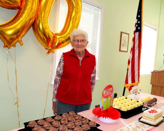 Photo by Roger Gavan Lorraine Dubin is about to serve the cakes for her 90th birthday celebration at The Warwick Valley Seniors Club