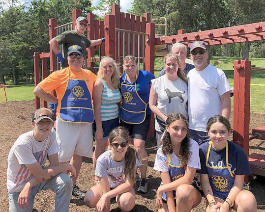 Rotarians and members of Warwick High School Interact recently painted Town Park playground equipment.
