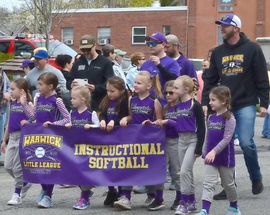 Members of Warwick Little League’s Instructional Softball team march in the parade on Saturday., April 23.