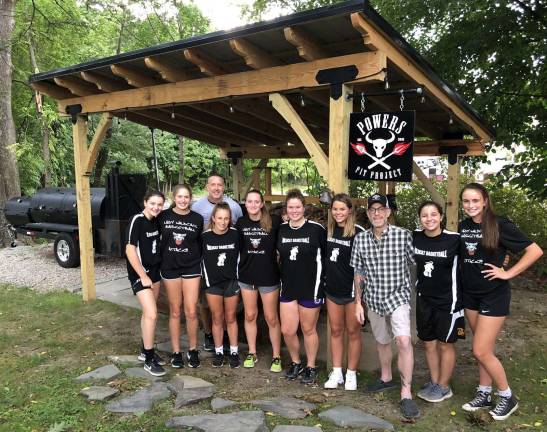 Provided photo The Warwick Valley High School Girls Varsity Basketball team with, from left, Coach James O'Brien and Baird's Tavern owner Adam Powers.